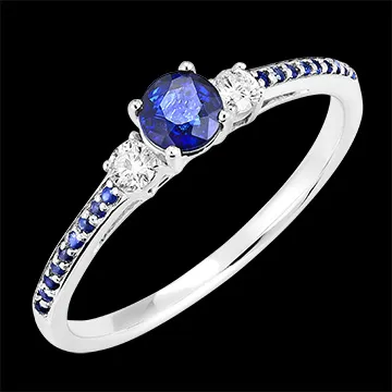 « L'Atelier » n. 161236 - Anello Oro bianco 9 carati - Zaffiro blu Rotonda 0.3 Carati - Pietre laterali Diamante - Incastonatura Zaffiro blu